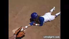 Play Little April teases her pussy outdoors while fingering herself during a baseball game